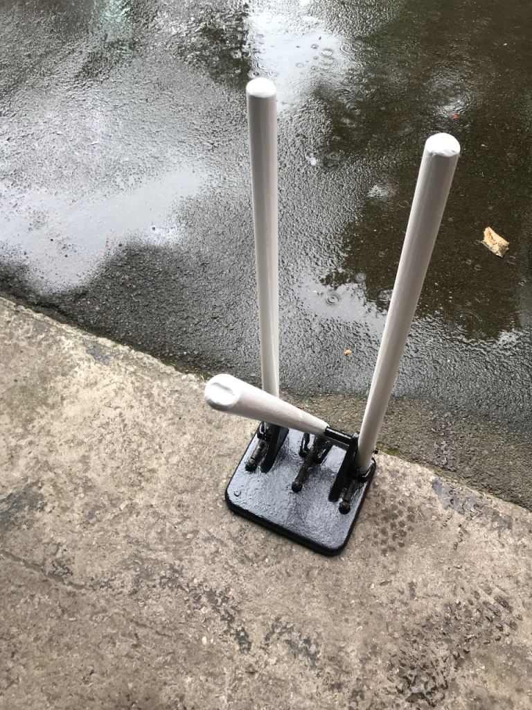 Vintage Spring Back Cricket Stumps on a Cast Iron Base, refurbished great condition