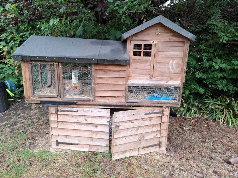 Large rabbit hutch complete with storage for hay bale underneath (rabbit not included) 