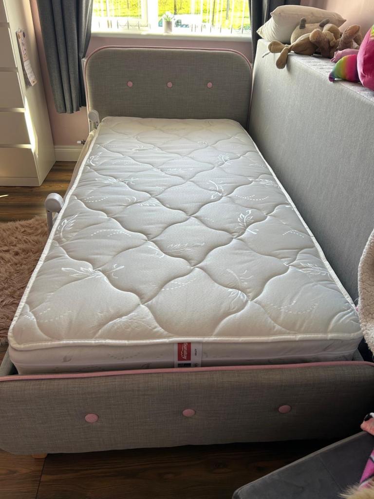 Single bed frame with mattress and beside cabinet