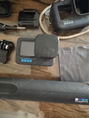 GoPro 12 Black HD video picture and accessories, also has curved max lense and the standard lense.