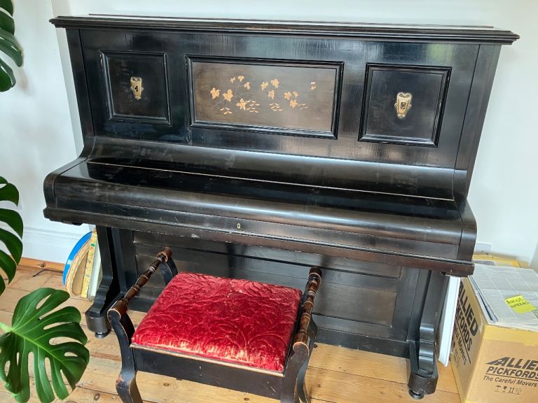 Early 20C acoustic upright piano by Ronisch with ornamental inlay