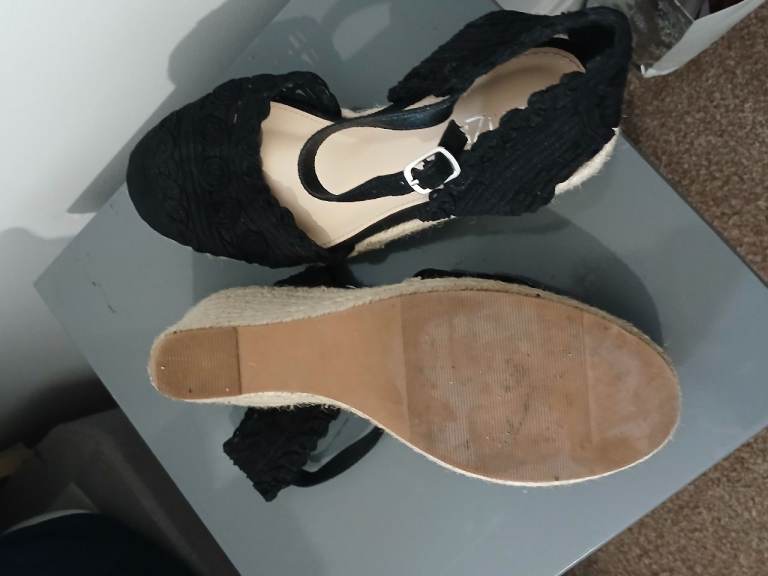 Black wedge Linzi shoes.