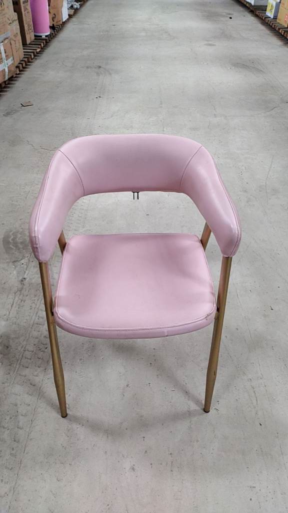 Cafe Pink faux leather accent chair featuring sleek gold-toned metal legs.