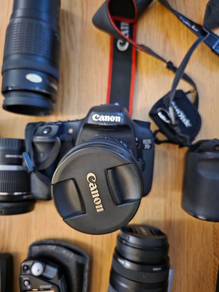 2 canon cameras with loads of accessories.