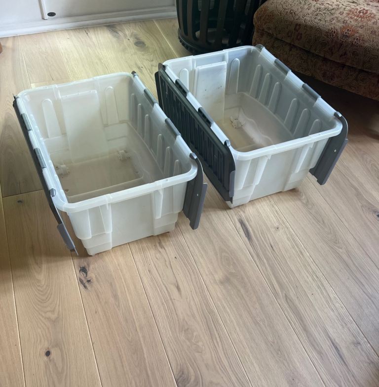 Two Plastic storage boxes with built in lid