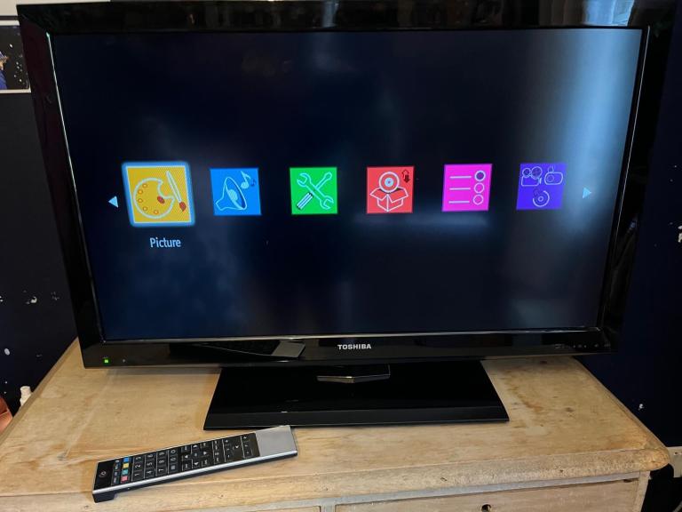 Toshiba Flat Screen TV, Black, 31 Inches, On a Fixed Stand, 2 Remote Controls, Working, VGC