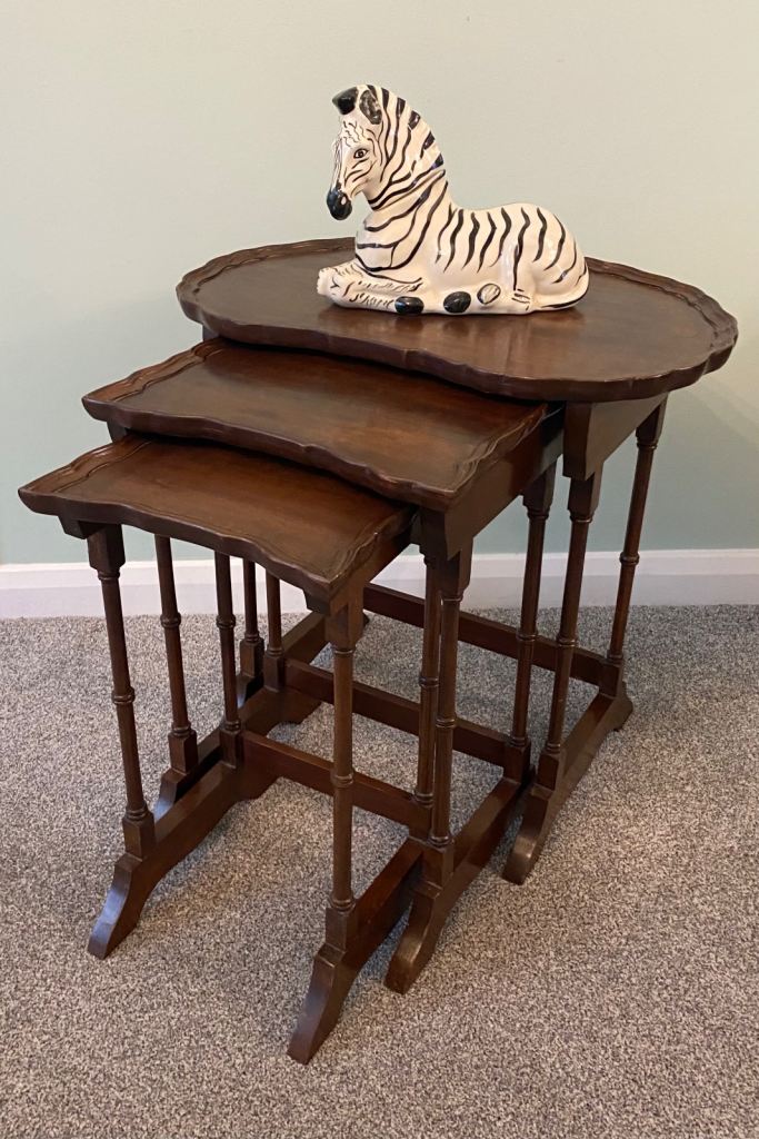ANTIQUE NEST OF TABLES WITH PIE-CRUST EDGES