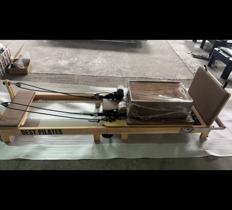 ONE LEFT brown FOLDABLE professional Pilates reformers 