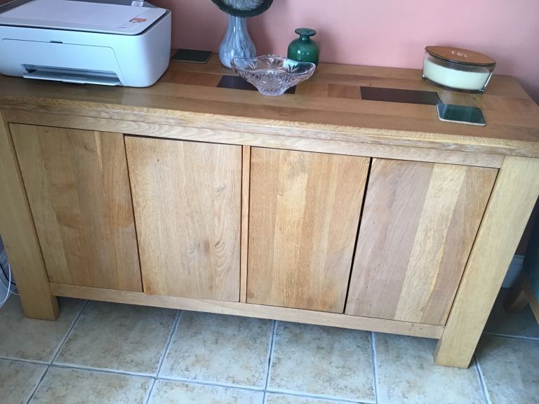 Sideboard with sprung loaded doors
