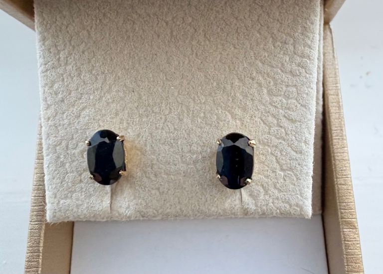 New 9 carat gold dark sapphire stud earrings - cost £240. Sell £100 ono