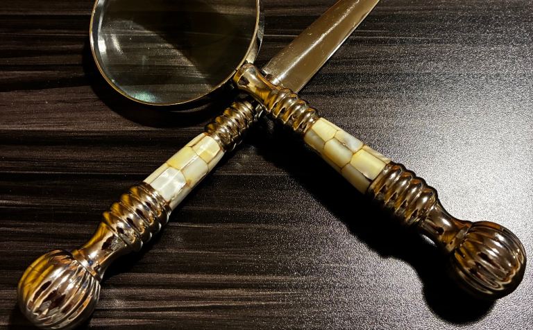 Vintage magnifying glass and letter opener , handles set in mother of pearl , 