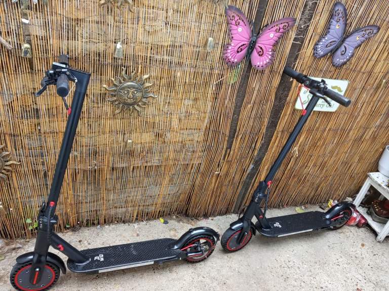 Two Black Electric Scooters - Good Working Order