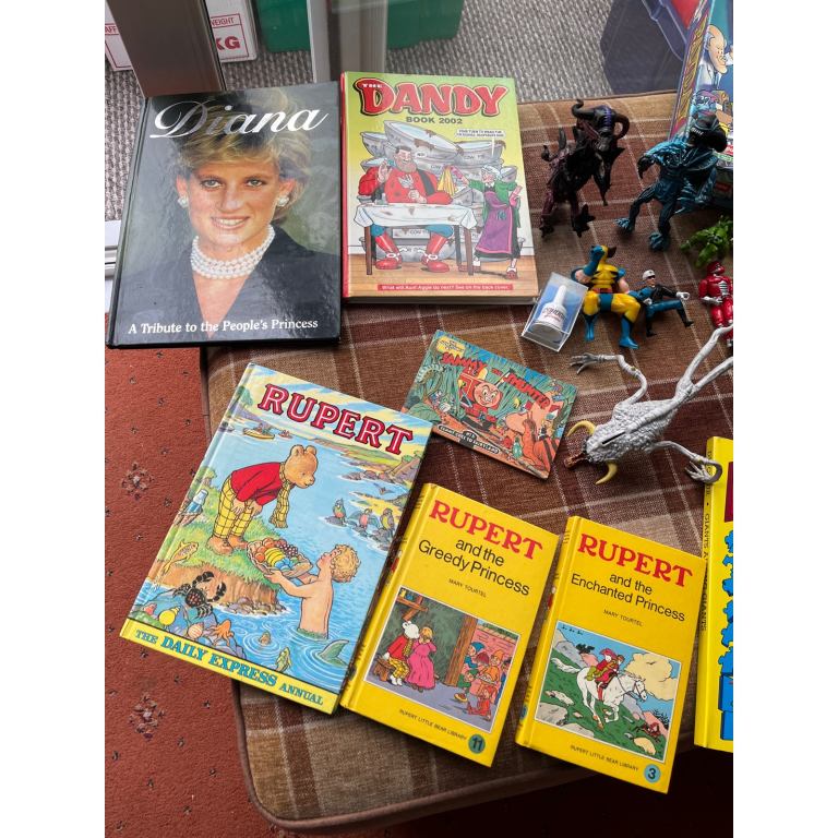 Selection of books games figures etc 