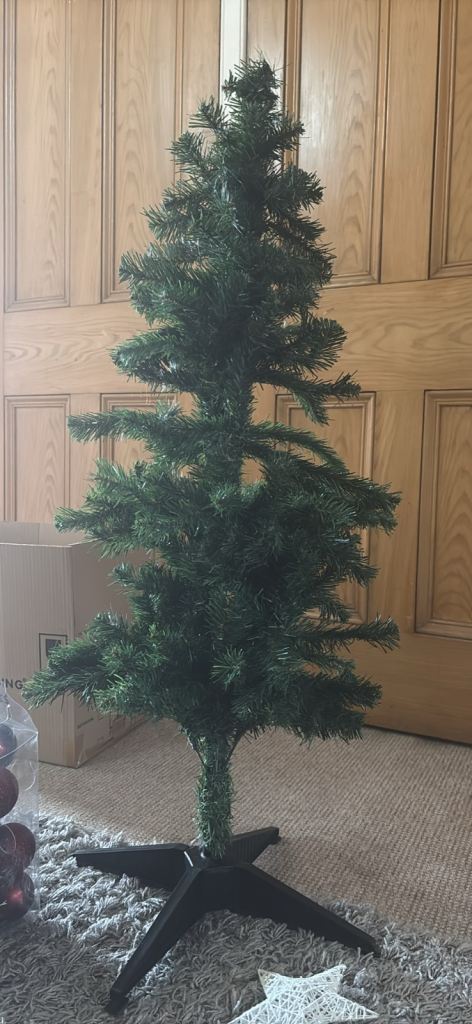 Small Artificial Christmas Tree with decorations. 