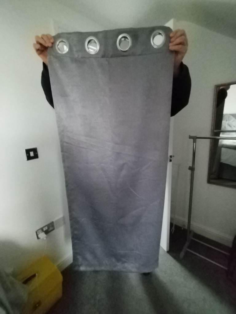 Pair of Black out curtains in shiny grey