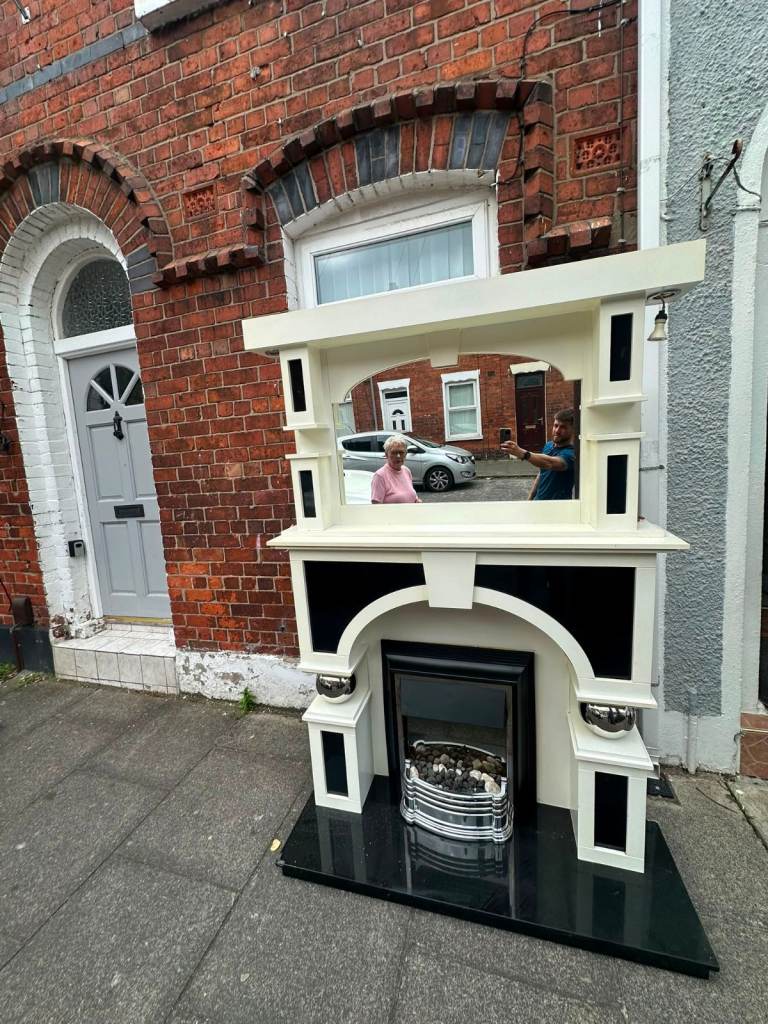 Really nice fireplace with electric fire inset and matching mirror £120 the whole lot