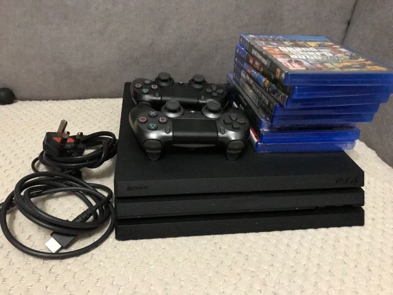 Sony Playstation 4 PRO Console 1TB - Black bundle with 8 games and two controllers