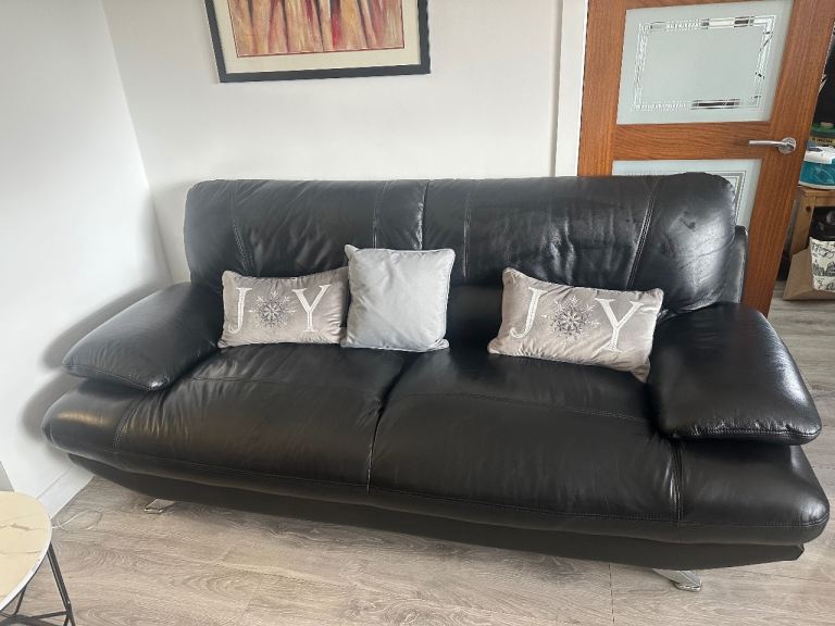 Two sofas and ottoman pouffe 