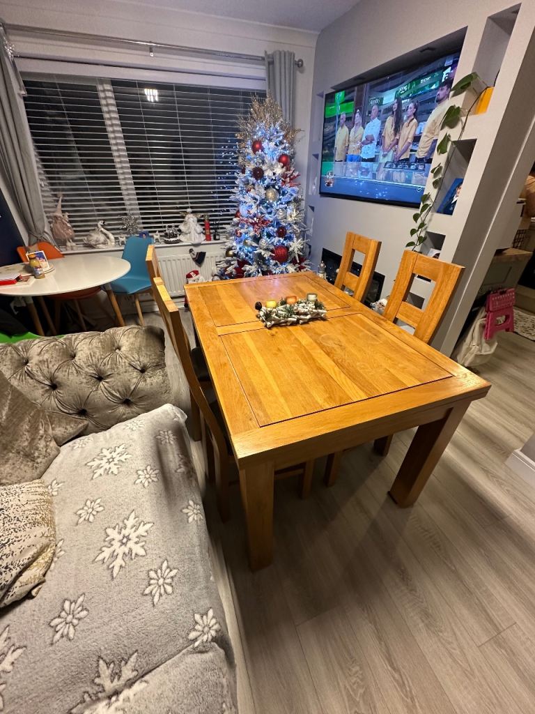 Solid oak wood dining table and four chairs 