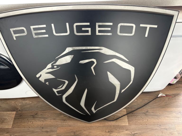 Peugeot dealers sign man cave garage 