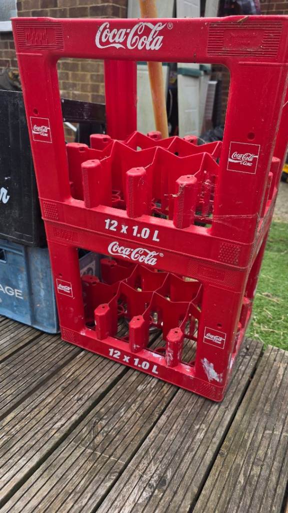 Vintage Coca-Cola, Paderborner, and Courage Bottle Crates