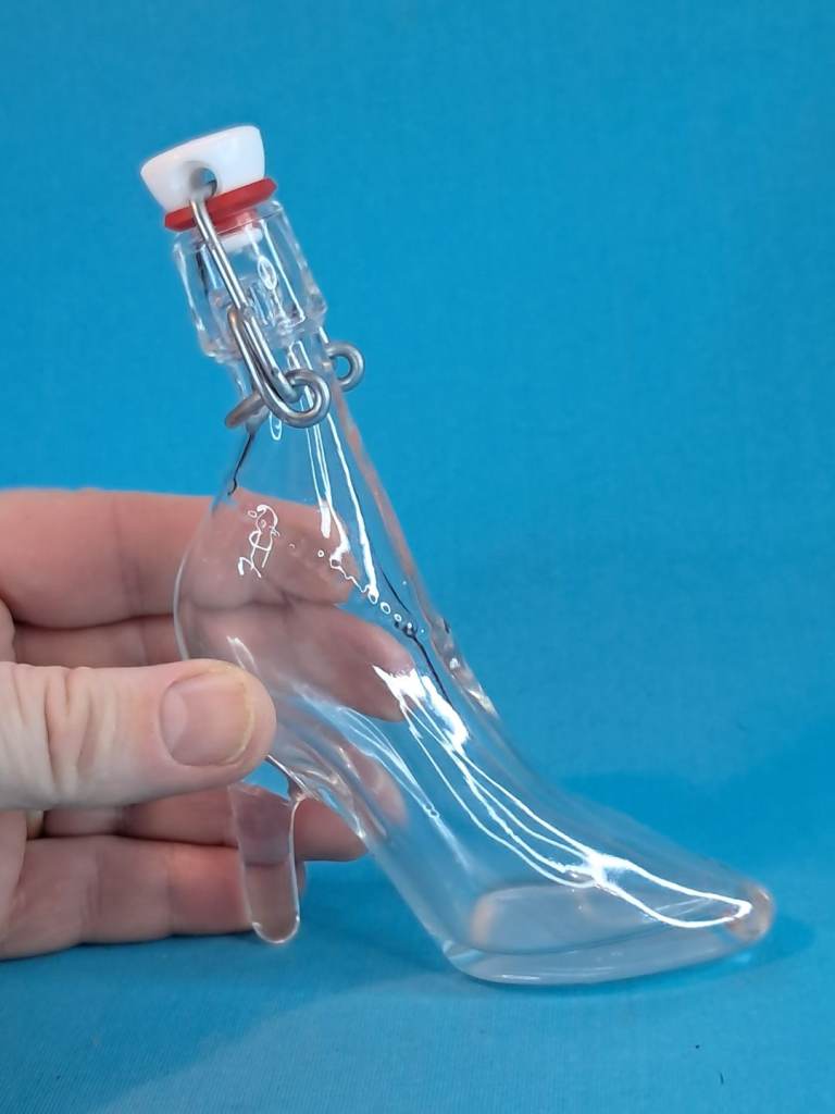 Vintage depose Kefla. 5-inch 40ml.miniature glass bottle in the shape of a high-heeled shoe