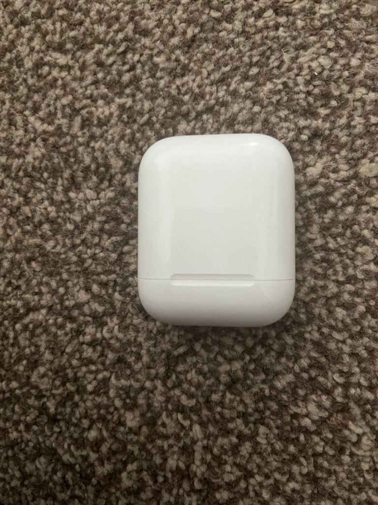 Apple AirPods with Charging Case – Good Condition