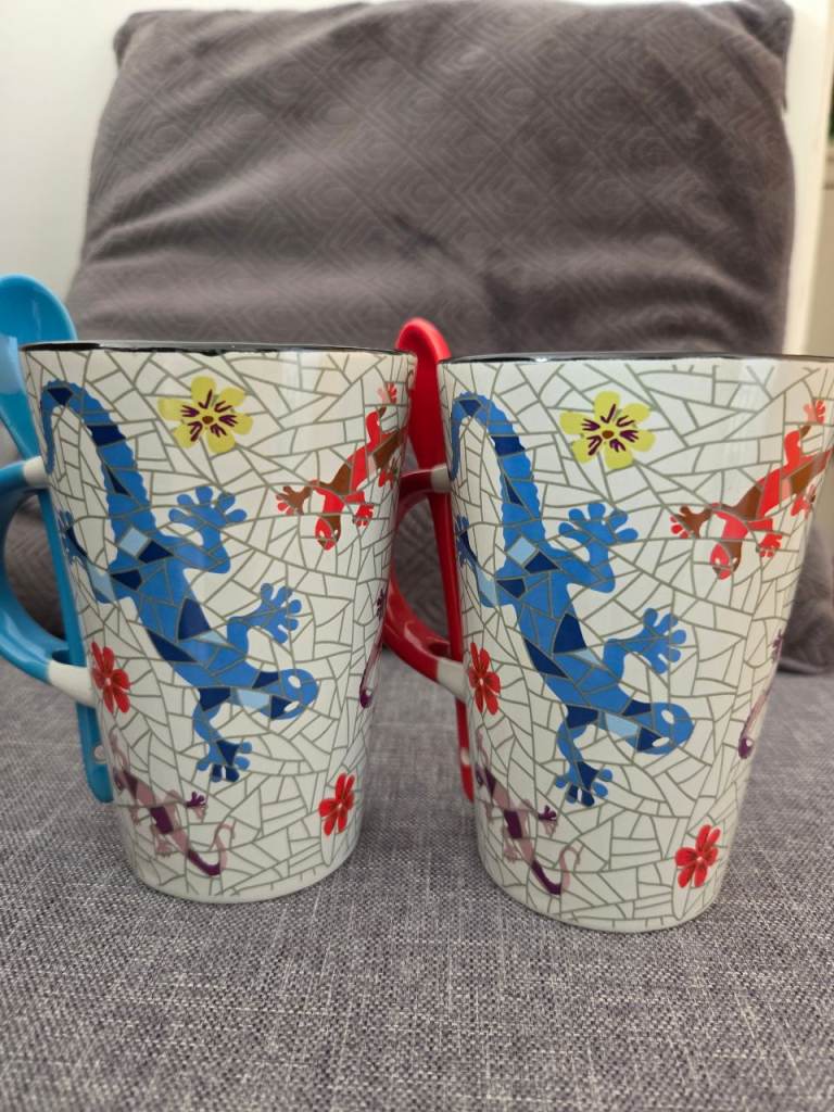 Two ceramic mosaic-style mugs