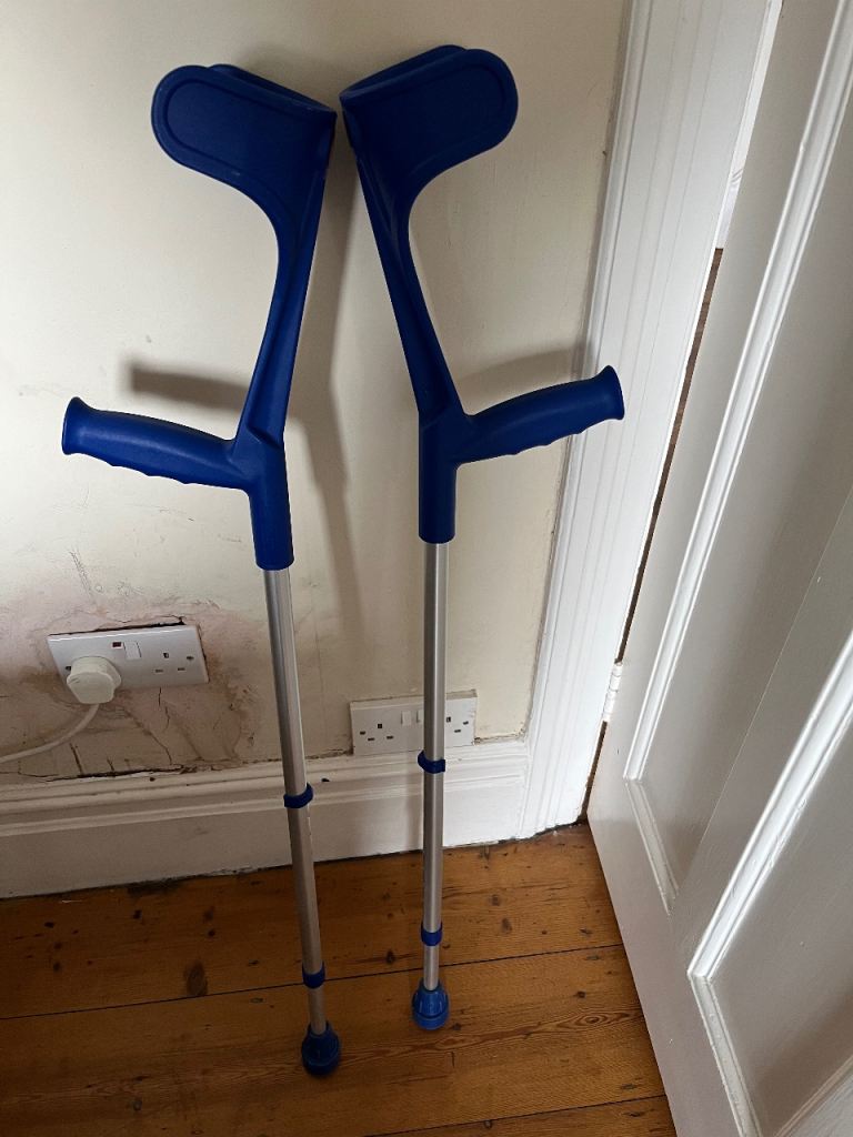Pair of height adjustable crutches