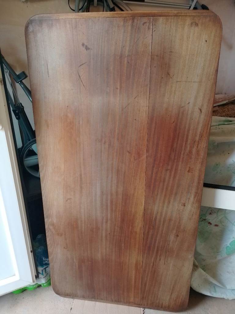 Tropical hardwood table top and trestle legs