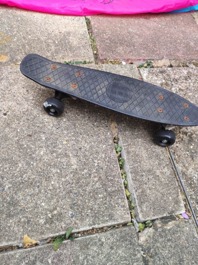 Black Penny Skateboard – Fair Condition