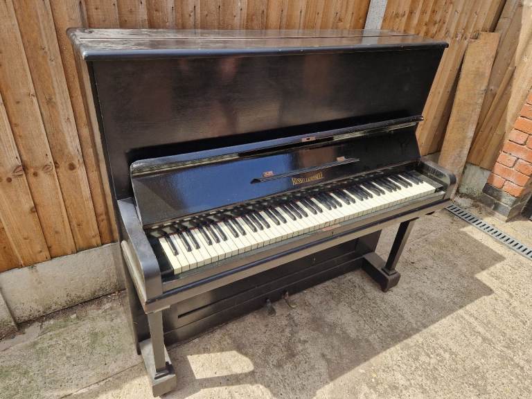 FREE Black Upright Russell Piano