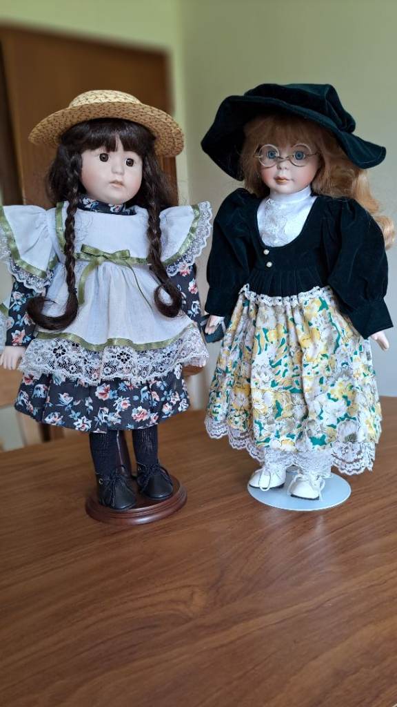 Pair of Collectable Porcelain Dolls with Stands