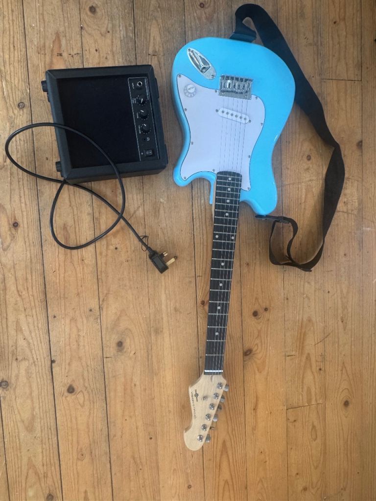 Light Blue Electric Guitar with Amp – Good Condition