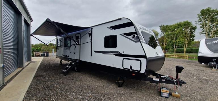 American Caravan 5th Wheel display New Forest River East West Longitude 310RL 