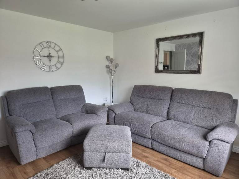 Grey reclining sofas and storage pouffe 