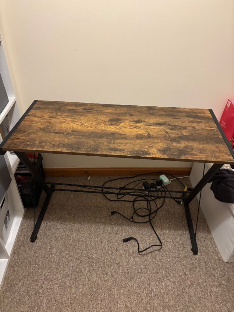 Brown desk with metal legs