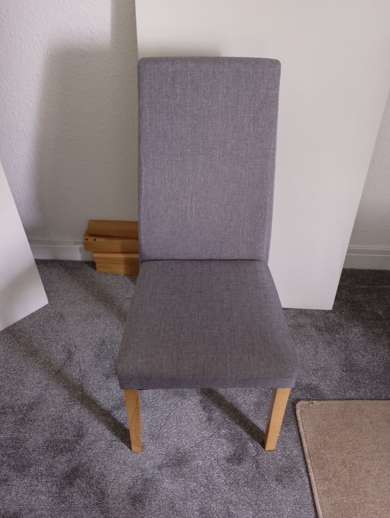 White dining table and 3 grey chairs