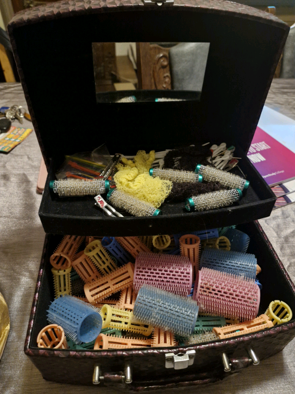 Setting rollers and hooded hair dryer