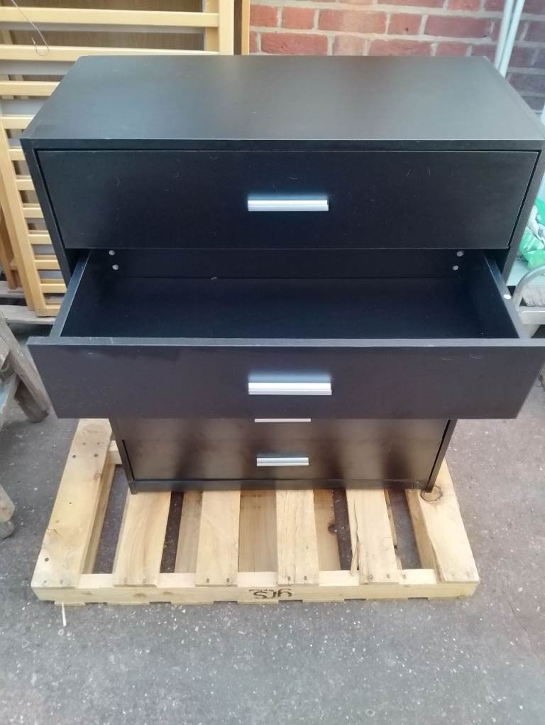 Chest of 5 jet black drawers in new condition spotlessly clean inside and out 