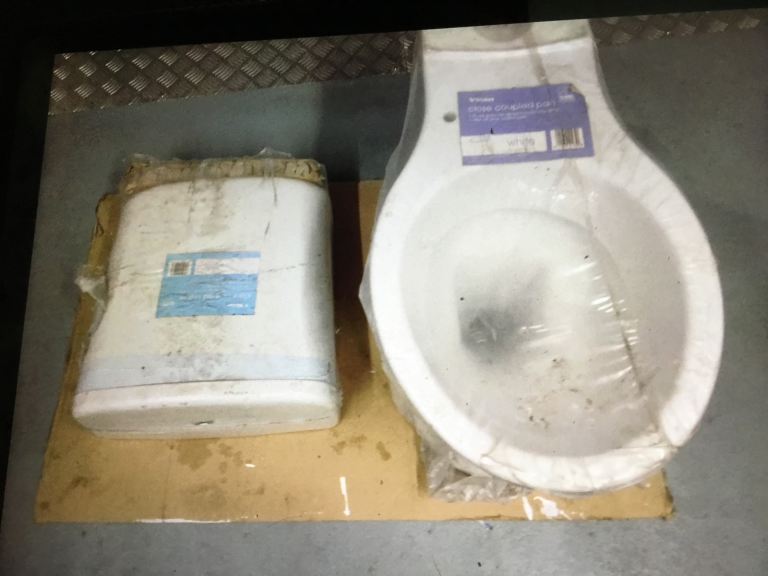 Brand new toilet/water tank and macerator unit in white.