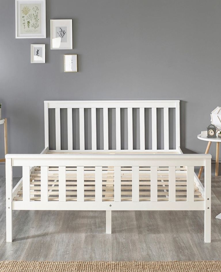 White wooden double bed 