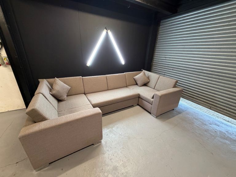 Large Beige U-Shaped Sofa with Storage