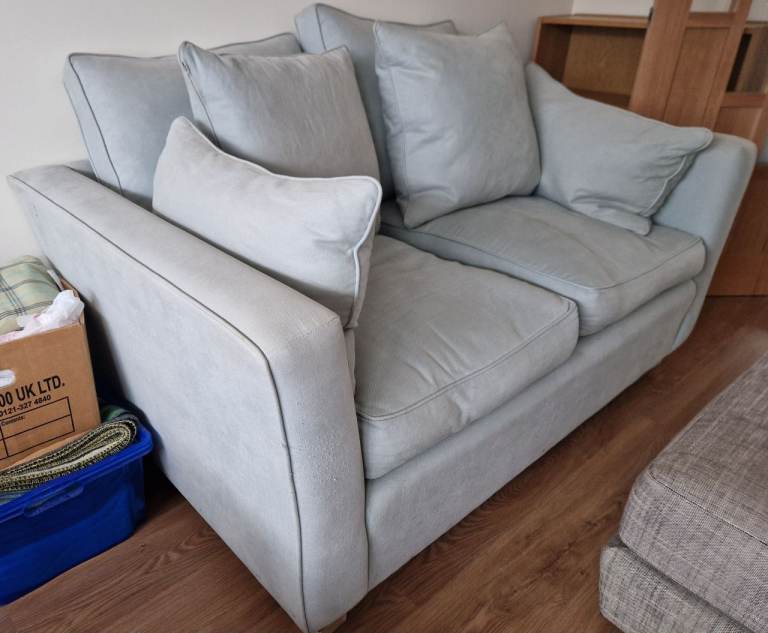 two-seater sofa. in good clean condition. from smoke-free and pet free home. light sage green colour