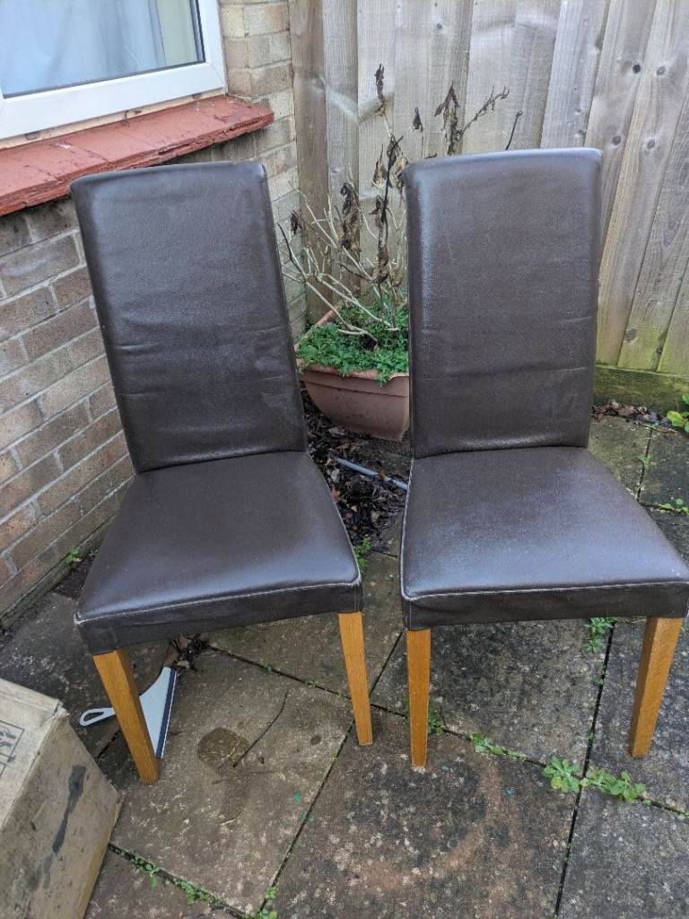 2 leather looking dining chairs 