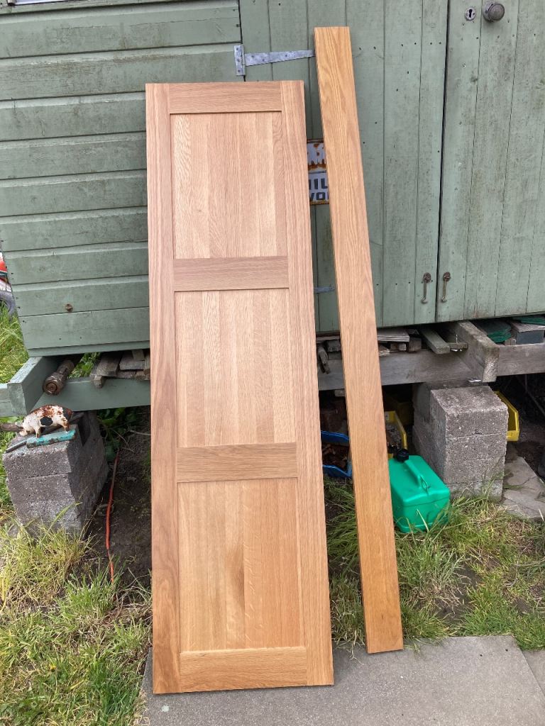 Oak cover panel front of bath