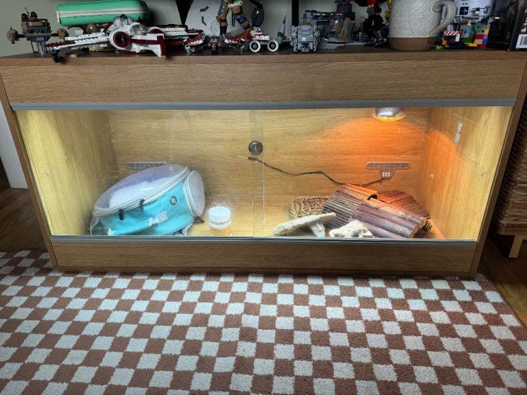 Large wooden vivarium with glass sliding doors and lighting