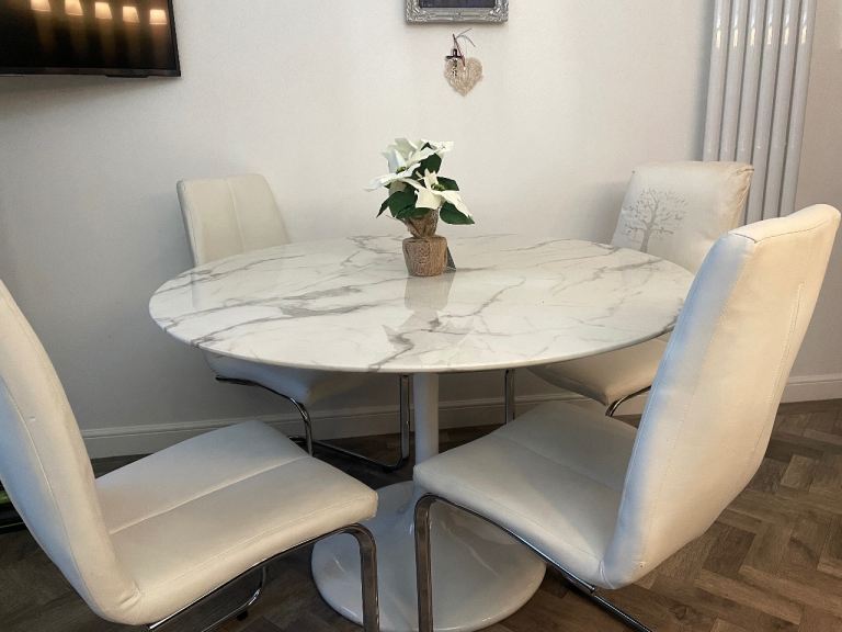 Furniture Village Marble effect circular table and four leather effect cream chairs 