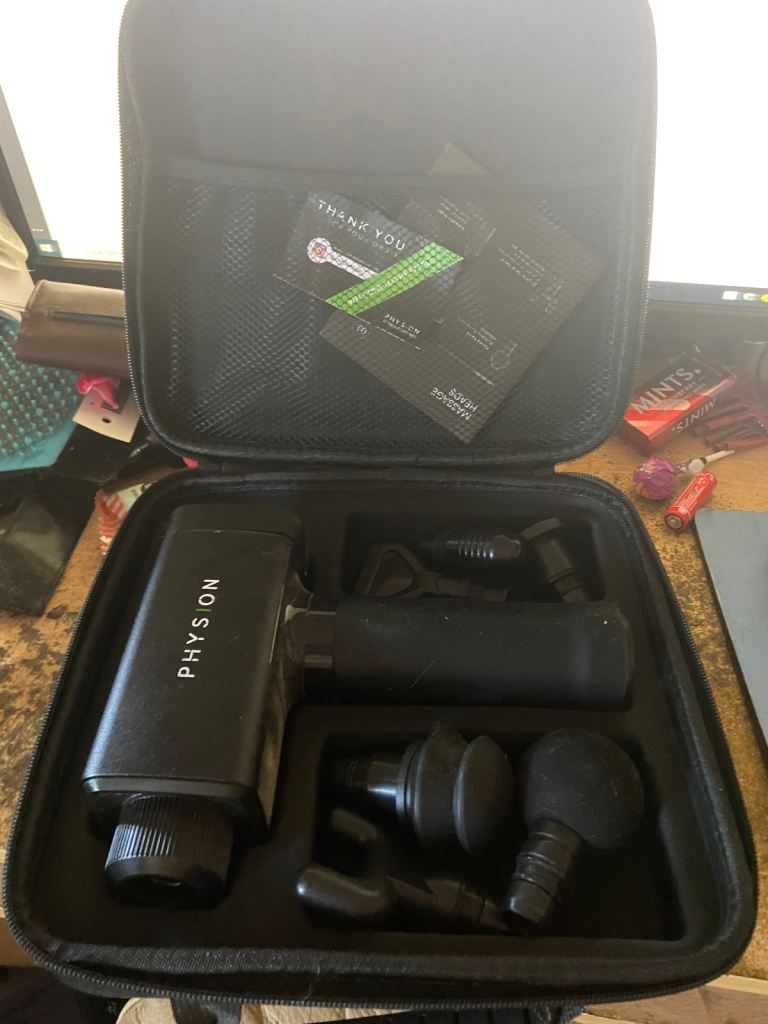 Physion PRO massage gun with accessories and carry case