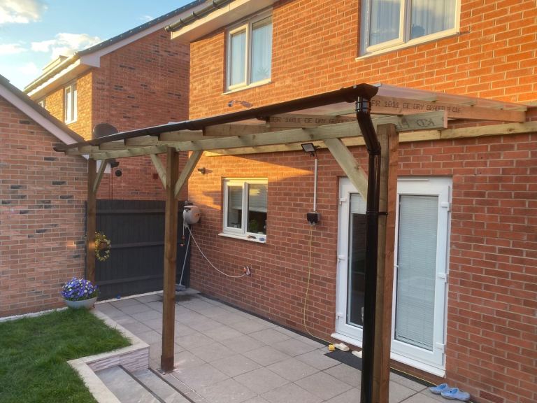 Pergola with clear polycarbonate roof 